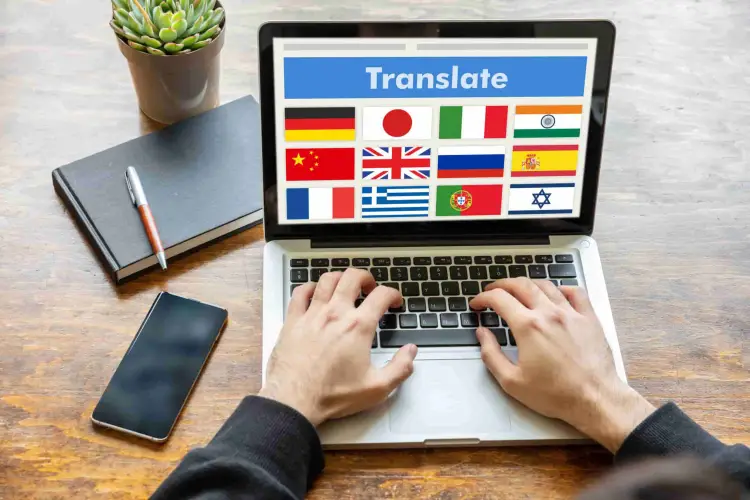 man-working-on-a-laptop-with-the-word-translate-on-J3A7WLH-1-scaled.jpg