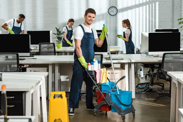 stock-photo-cheerful-cleaner-moving-cart-cleaning-supplies-multicultural-colleagues.jpg