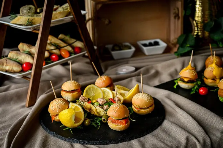mini-burgers-and-appetizers-on-rustic-display.jpg