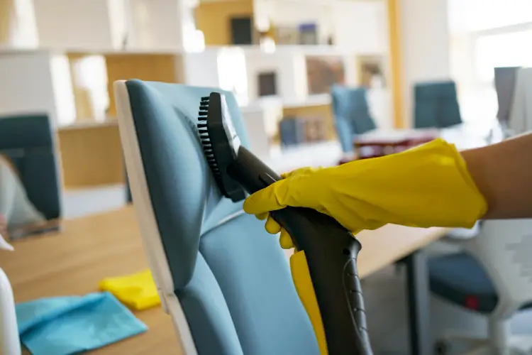 home-cleaner-vacuuming-chair.jpg