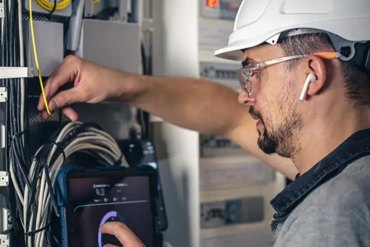 man-electrical-technician-working-switchboard-with-fuses_169016-24803.jpg