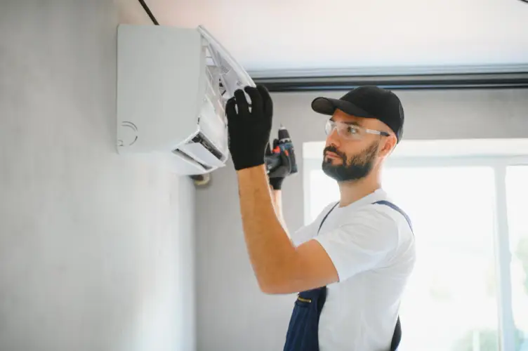 hvac-professional-installing-indoor-ac-unit.jpg