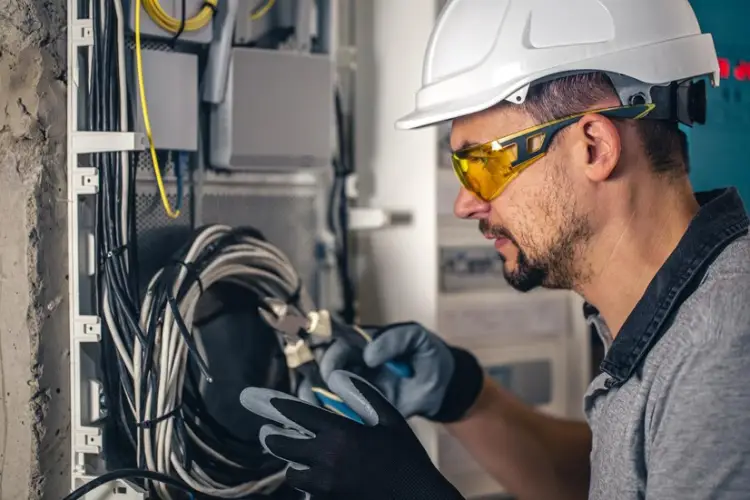 man-electrical-technician-working-switchboard-with-fuses_169016-24403.jpg