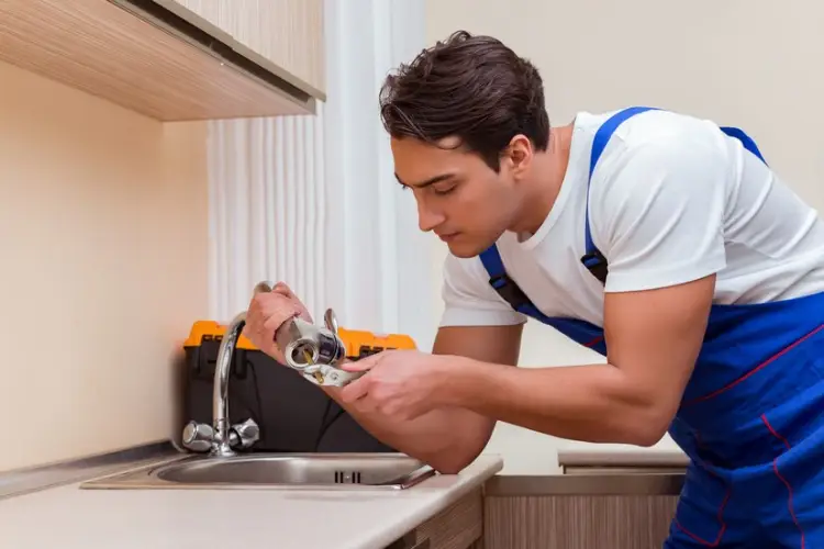 young-repairman-working-kitchen_85869-8136.jpg