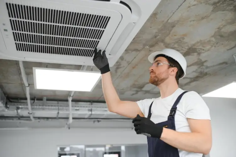 handsome-young-man-electrician-installing-air-conditioning_255667-46050.jpg