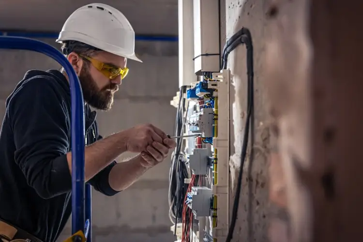 male-electrician-works-switchboard-with-electrical-connecting-cable_169016-15088.jpg