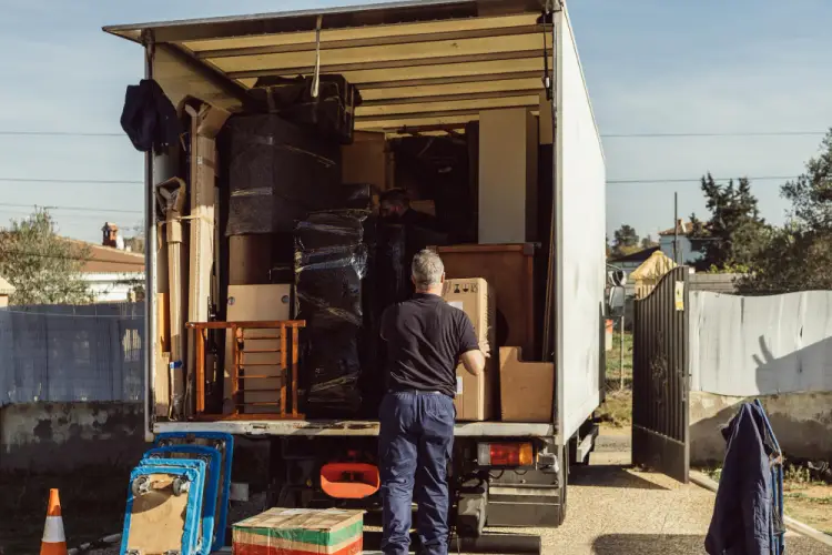 man-loading-furniture-into-moving-truck.jpg