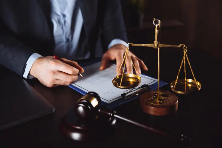lawyer-signing-legal-paperwork.jpg