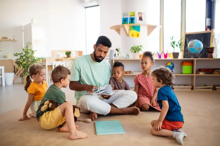 male-teacher-reading-to-children.jpg