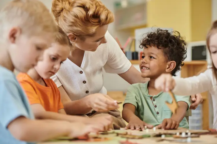 preschool-teacher-helping-kids.jpg