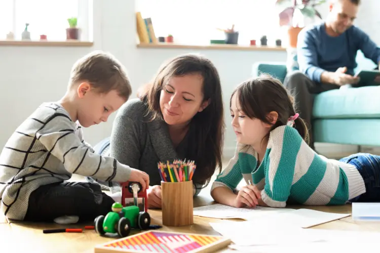 mother-playing-with-children-at-home-daycare.jpg