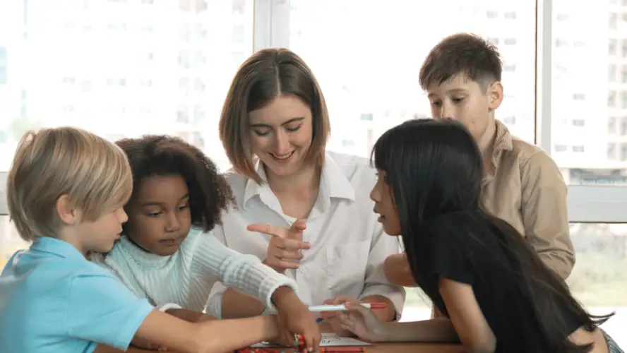teacher-engaging-with-group-of-kids-in-classroom.jpg