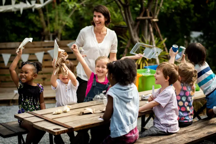 outdoor-recycling-activity-for-kids-with-teacher.jpg