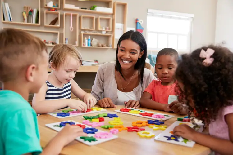 kids-solving-puzzles-with-teacher-in-daycare.jpg