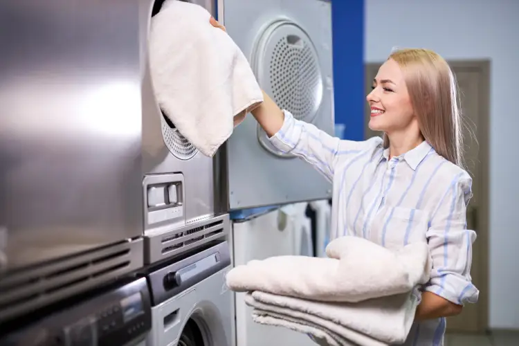 woman-loading-towels-into-dryer.jpg