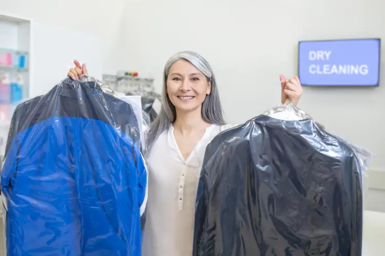 woman-holding-dry-cleaned-clothes.jpg