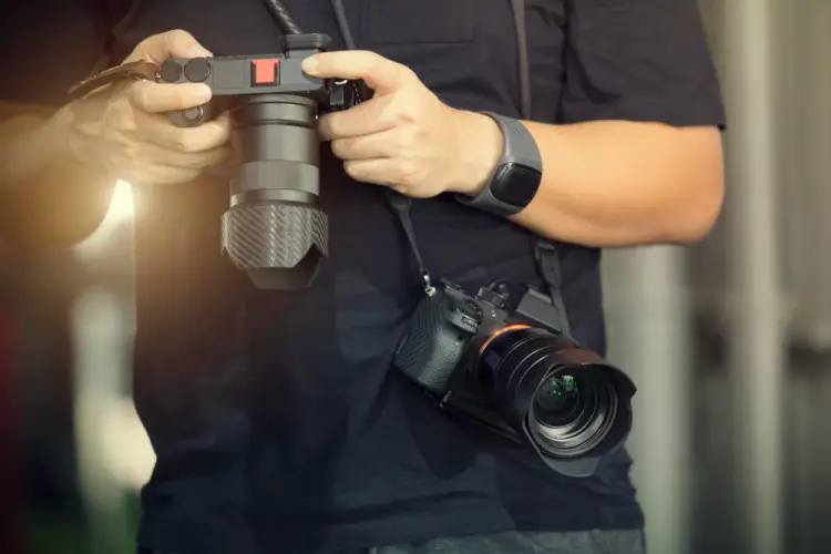 photographer-holding-two-professional-cameras.jpg