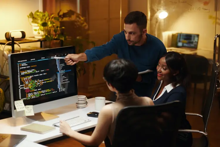 software-developer-team-explaining-source-code-office.jpg