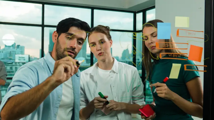 team-brainstorming-ideas-with-sticky-notes-glass-board.jpg