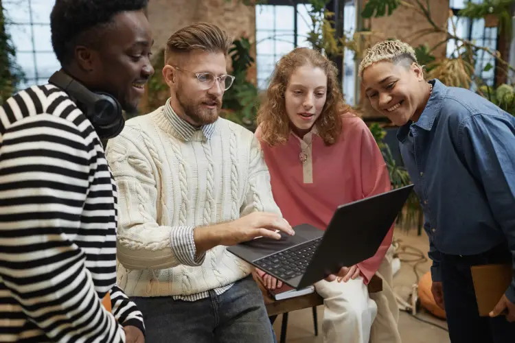 startup-team-analyzing-data-on-laptop-together.jpg