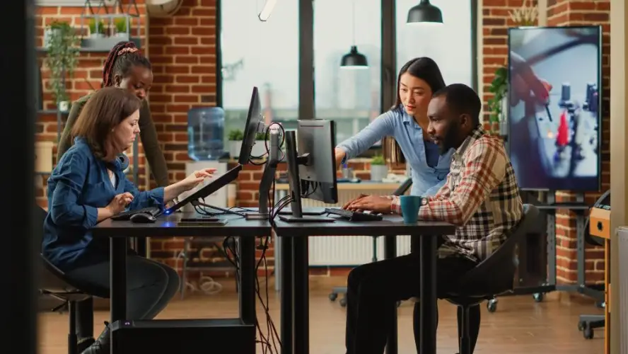 creative-office-collaboration-around-computers.jpg