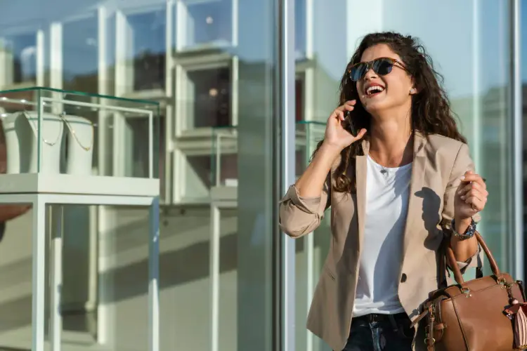 woman-shopping-urban-mall-talking-phone.jpg