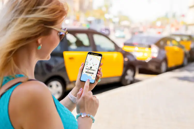 woman-booking-taxi-with-app.jpg