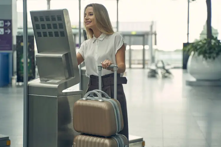 woman-using-airport-check-in-kiosk.jpg