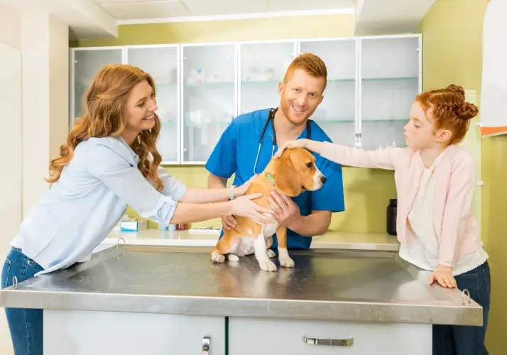 family-vet-visit-beagle-dog.jpg