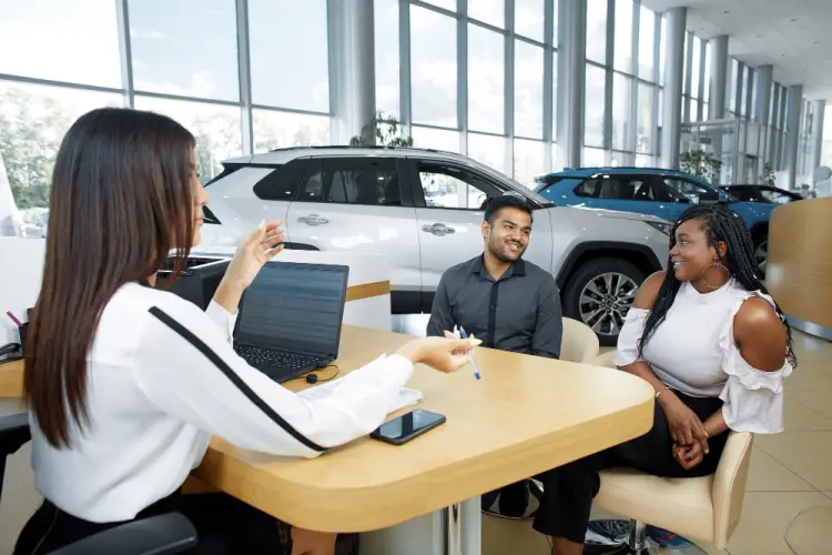 couple-talking-to-car-salesperson.jpg