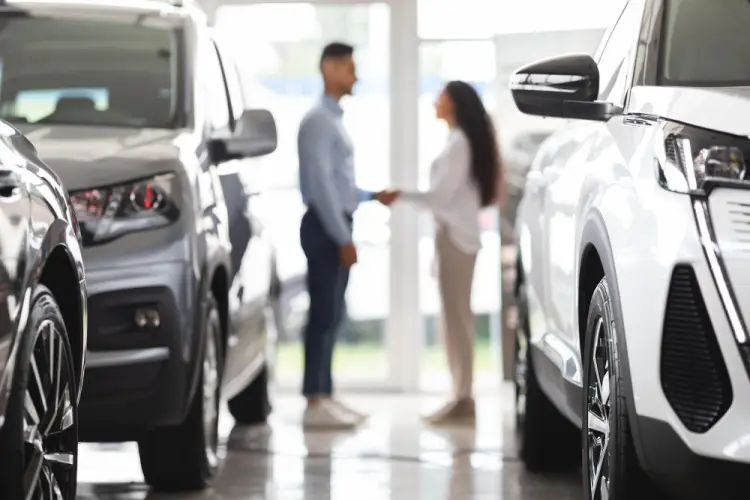blurry-sales-deal-in-car-showroom.jpg