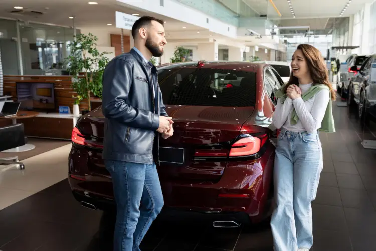 car-dealer-helping-customer-choose-vehicle.jpg