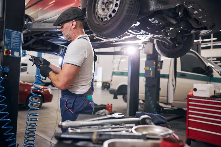 technician-fixing-car-under-the-hood.jpg