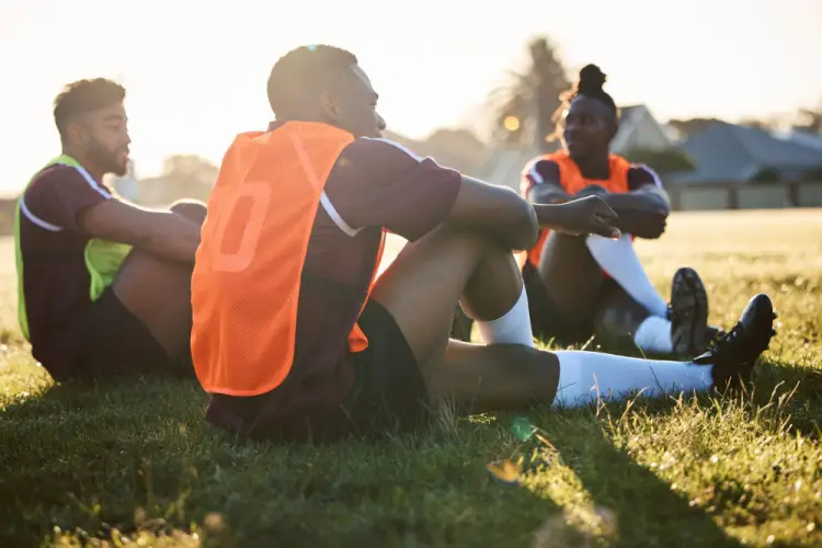 youth-soccer-team-sitting-on-field.jpg