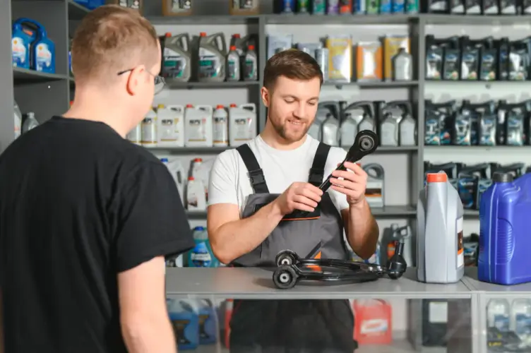 mechanic-helping-customer-car-parts.jpg