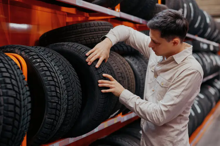 man-checking-tire-condition.jpg