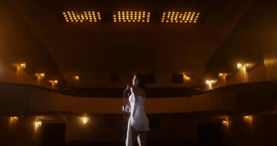solo-singer-performing-on-lit-theater-stage.jpg