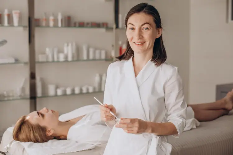 smiling-esthetician-with-spa-client.jpg