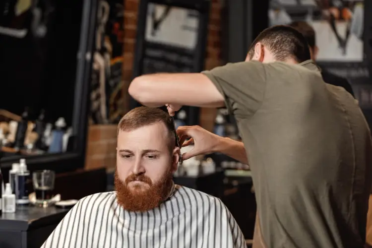 barber-cutting-hair-of-red-bearded-client.jpg