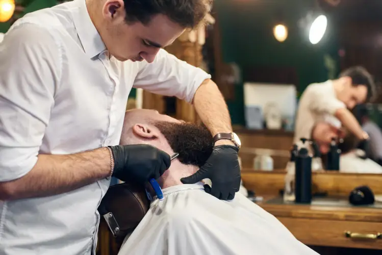 barber-giving-close-razor-shave-to-client.jpg