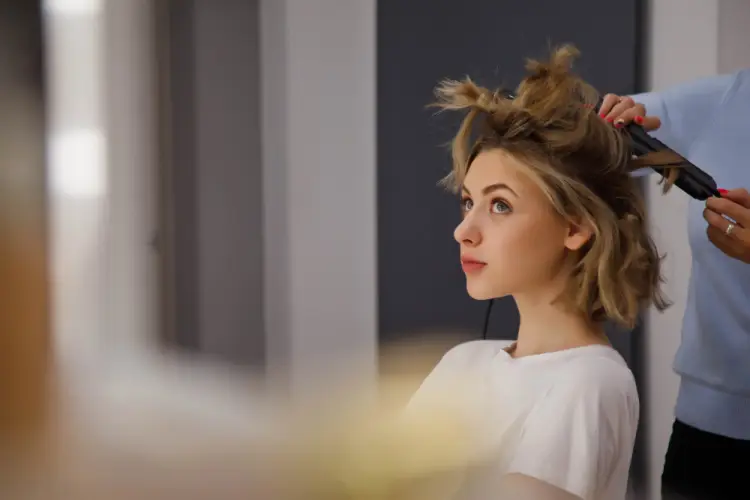 woman-getting-hair-curled-hair-styling.jpg