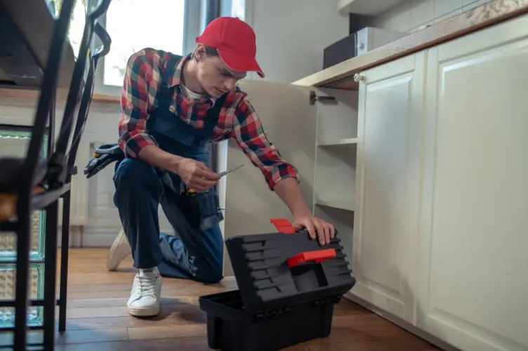 home-repairman-fixing-cabinet.jpg