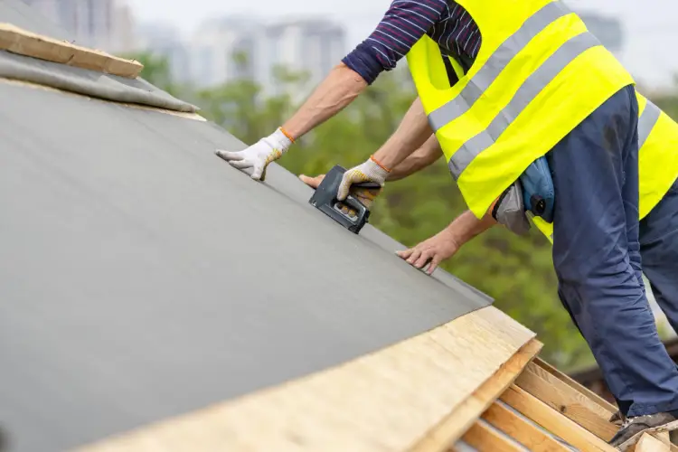 contractor-securing-weatherproof-layer-on-roof.jpg