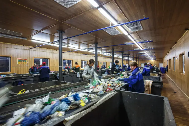 workers-sorting-garbage-at-recycling-facility.jpg