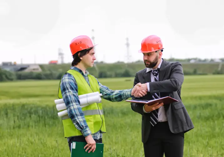 engineers-handshake-at-green-construction-site.jpg