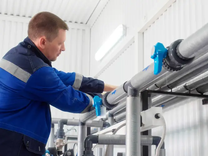 plumber-joins-pipe-coupling-inside-production-facility-worker-repairs-maintains-industrial-water-supply-system-real-workflow.jpg