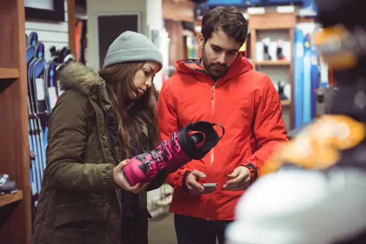 couple-shopping-snowboard-boots-sporting-store.jpg