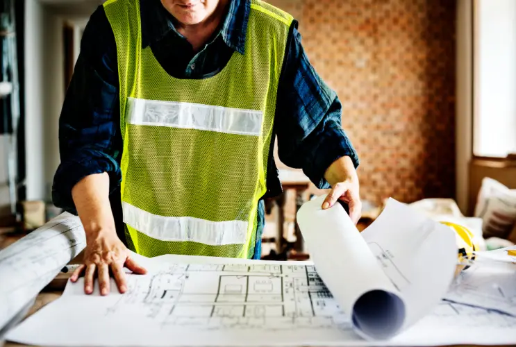 contractor-reviewing-building-blueprints-on-site.jpg