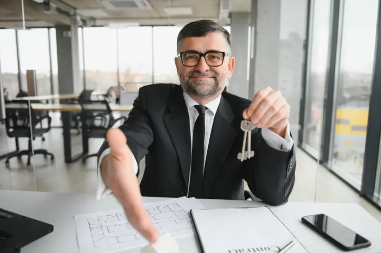 mature-realtor-handing-over-house-keys.jpg