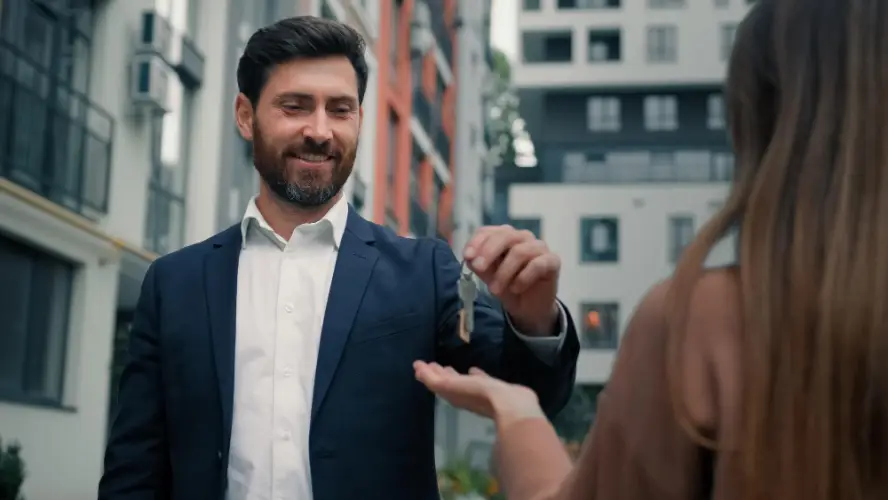 real-estate-agent-handing-keys-to-client.jpg